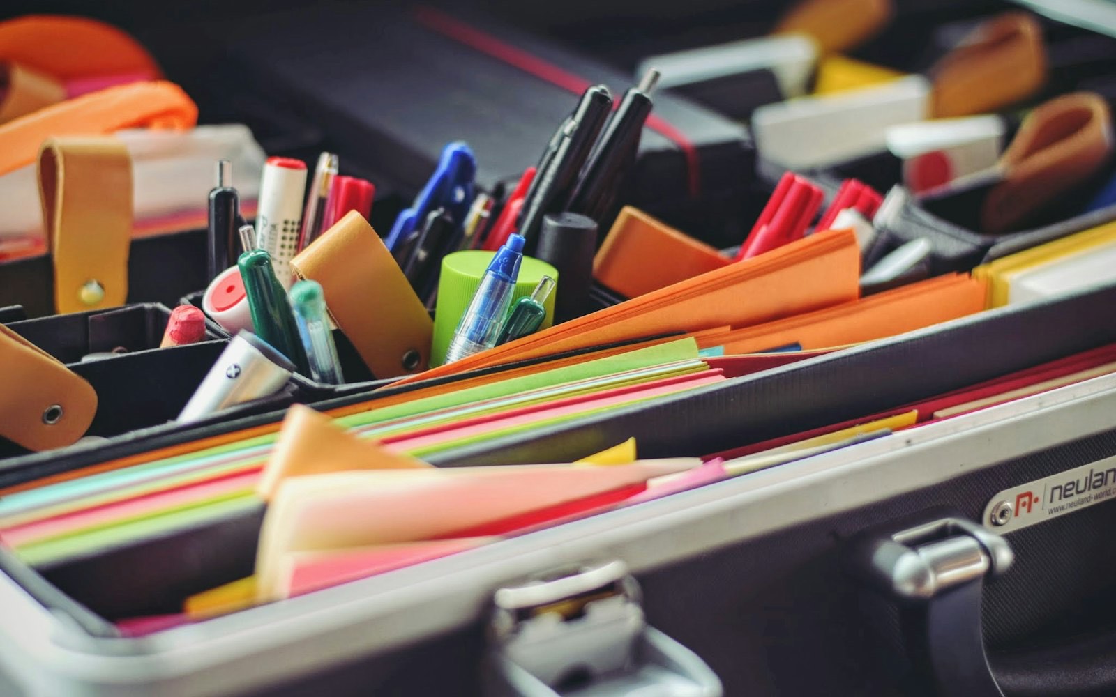 A colorful arrangement of pens and sticky notes