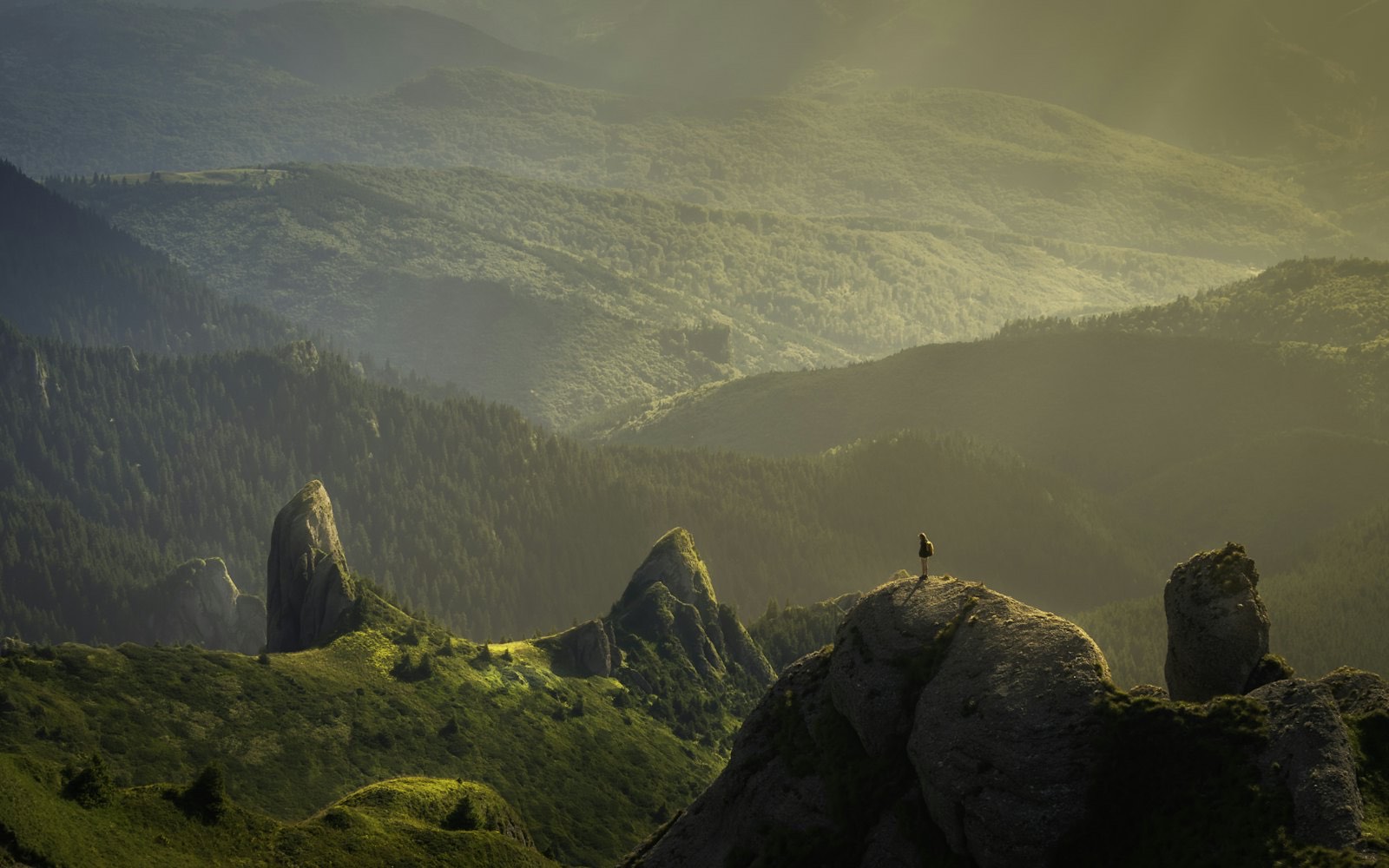 Golden sunrise light over a mountain range